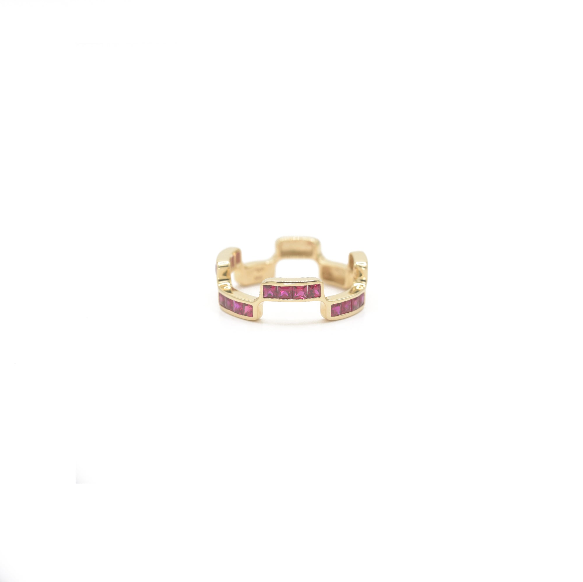 Puzzle Block ring with Ruby gemstones on a white background