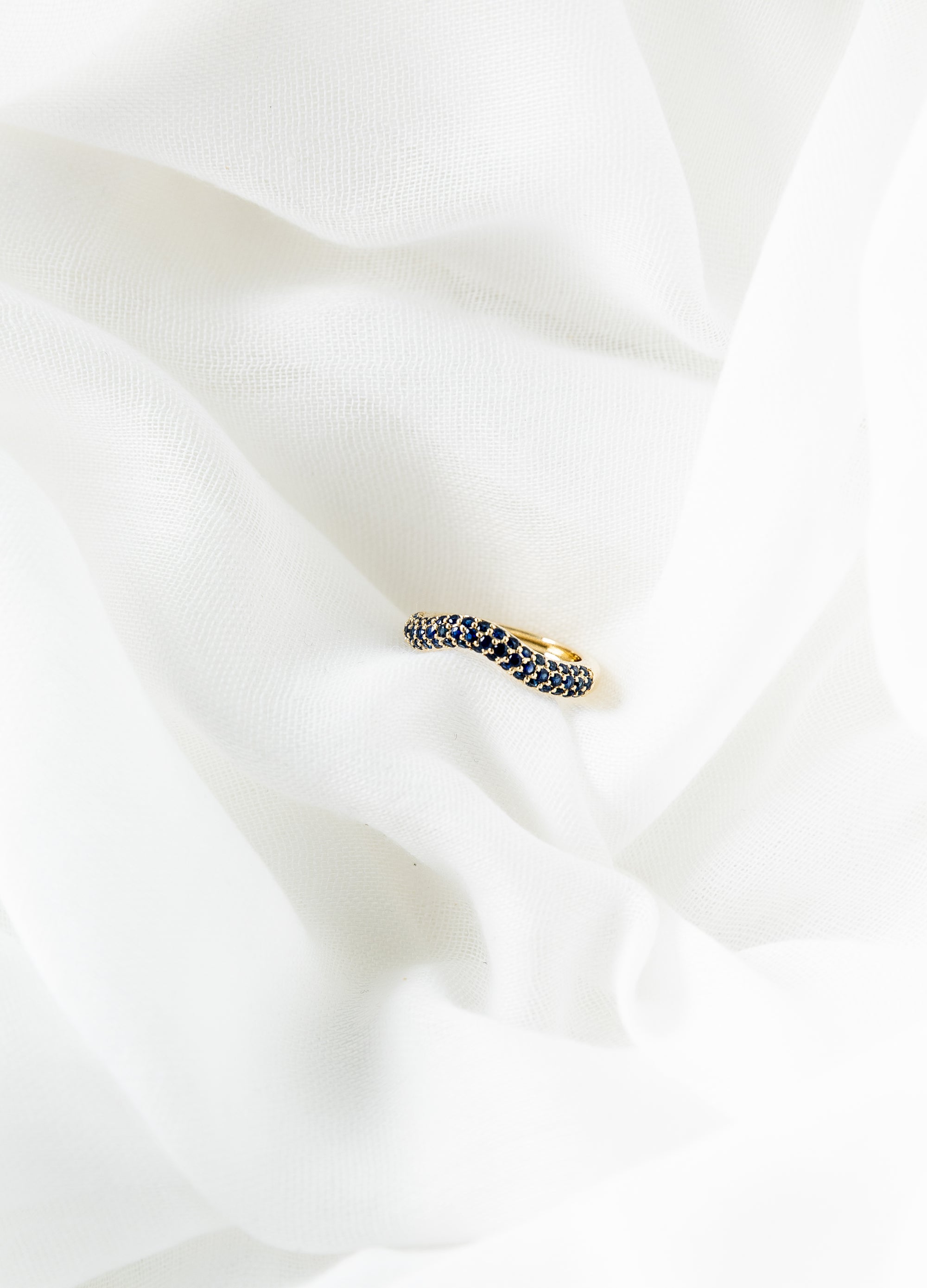 Beth Ring in 14K gold with pavé blue sapphires and wave design