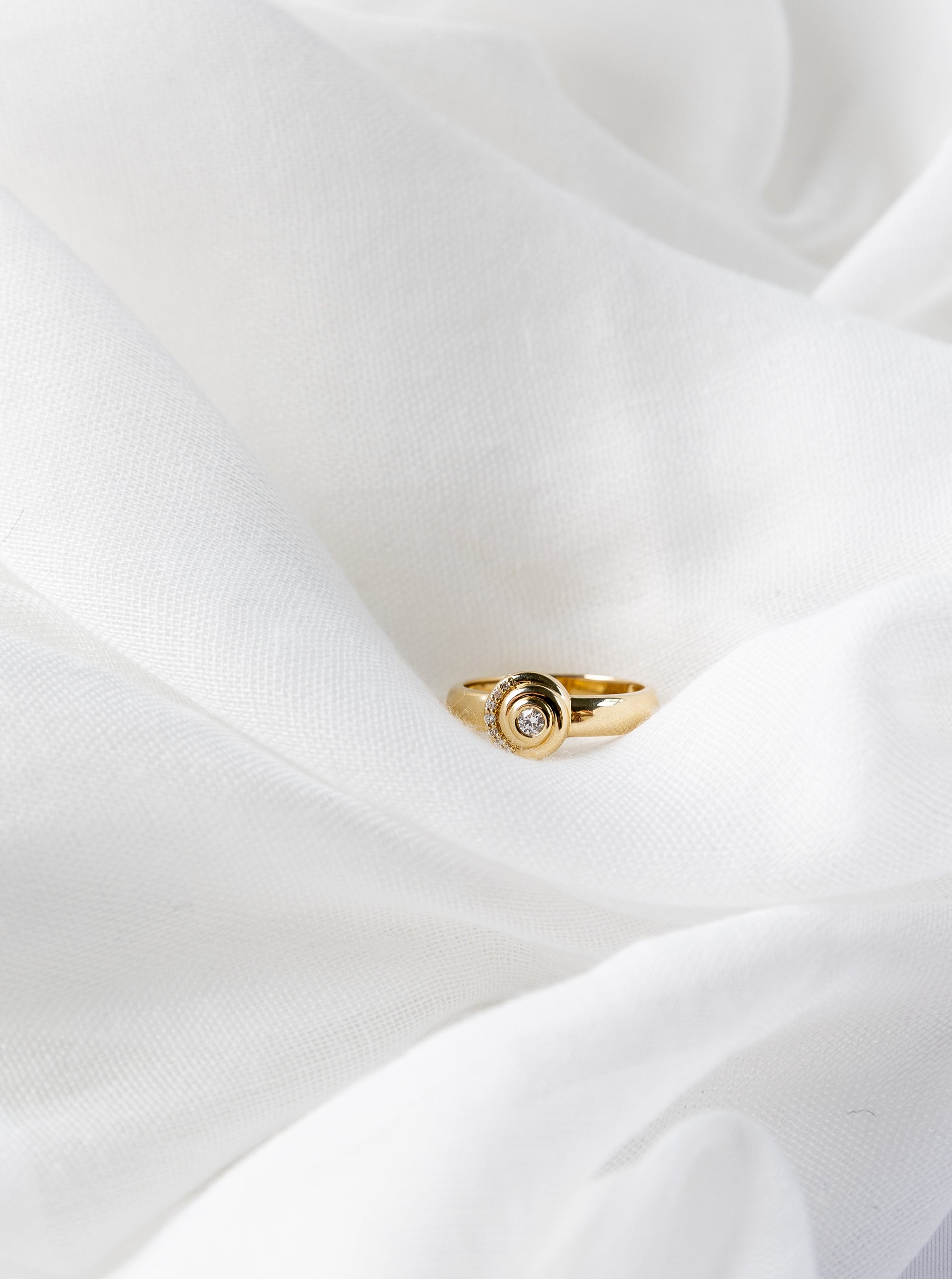 Khushi Ring in 14K yellow gold with spiral design and white diamonds