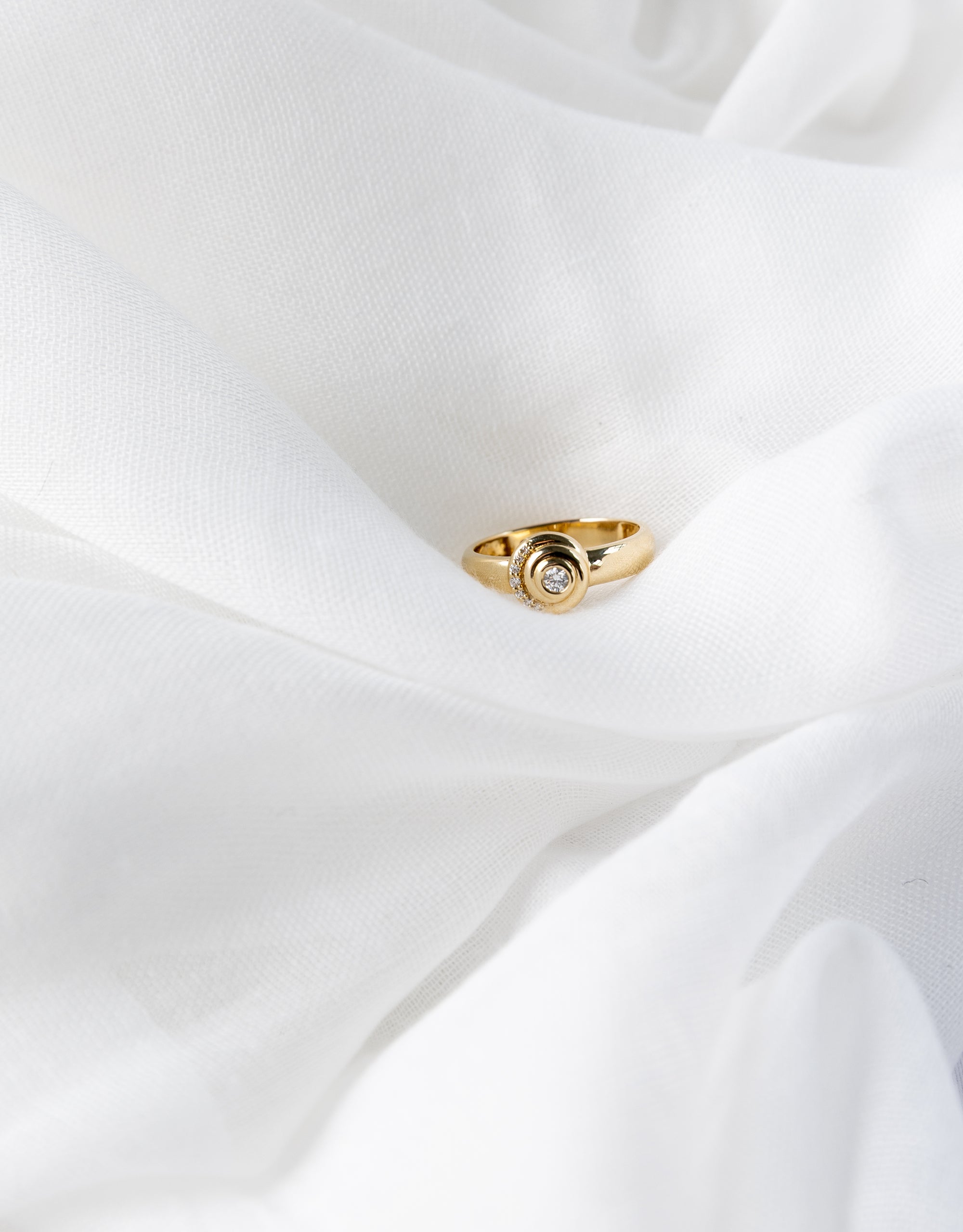 Khushi Ring in 14K yellow gold with spiral design and white diamonds