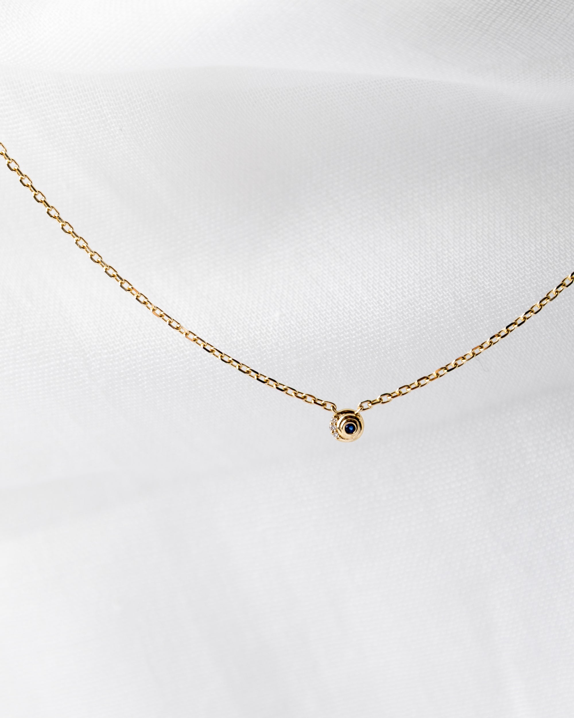 Nicole Necklace in 14K gold with spiral chain and white diamonds and blue sapphires