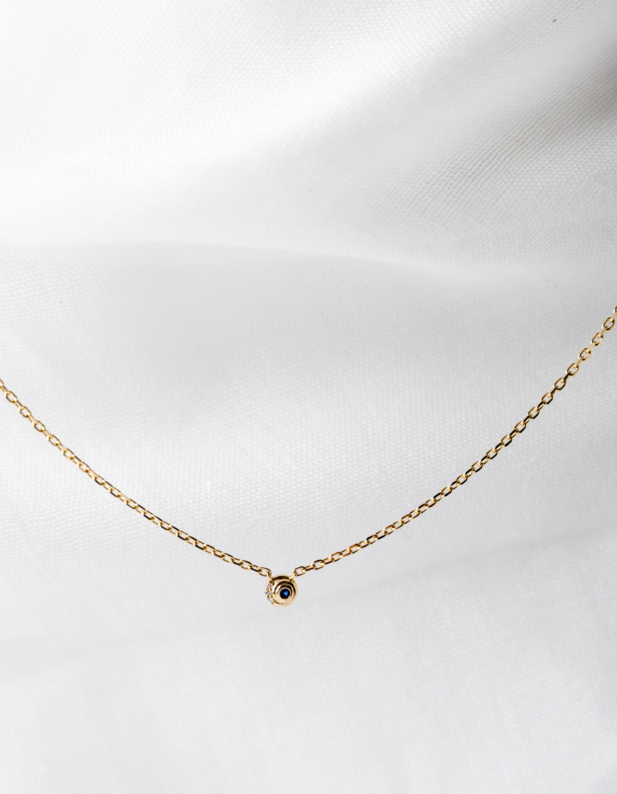 Nicole Necklace in 14K gold with spiral chain and white diamonds and blue sapphires