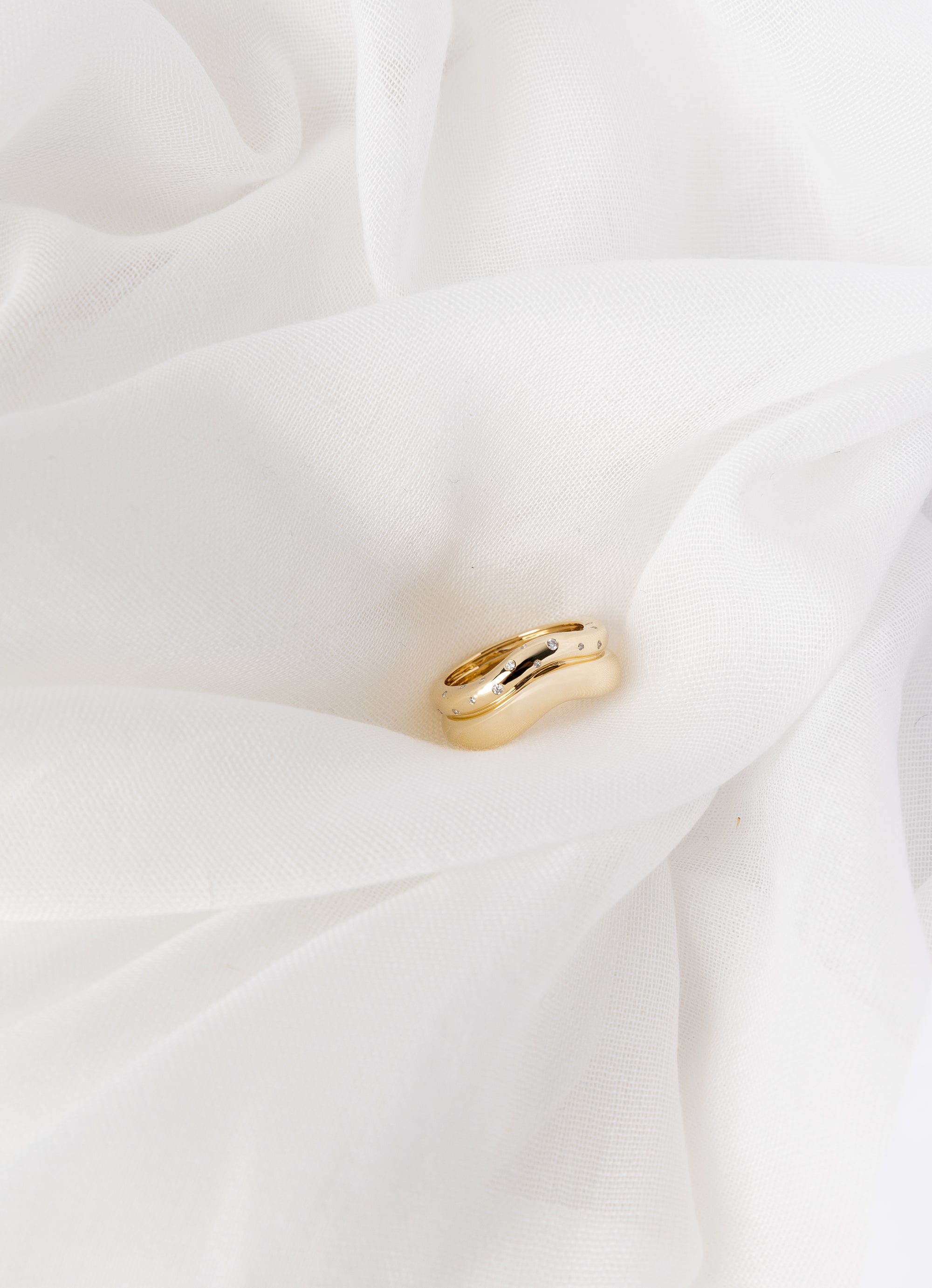 Shari Ring in 14K yellow gold with scattered white diamonds and wave bands