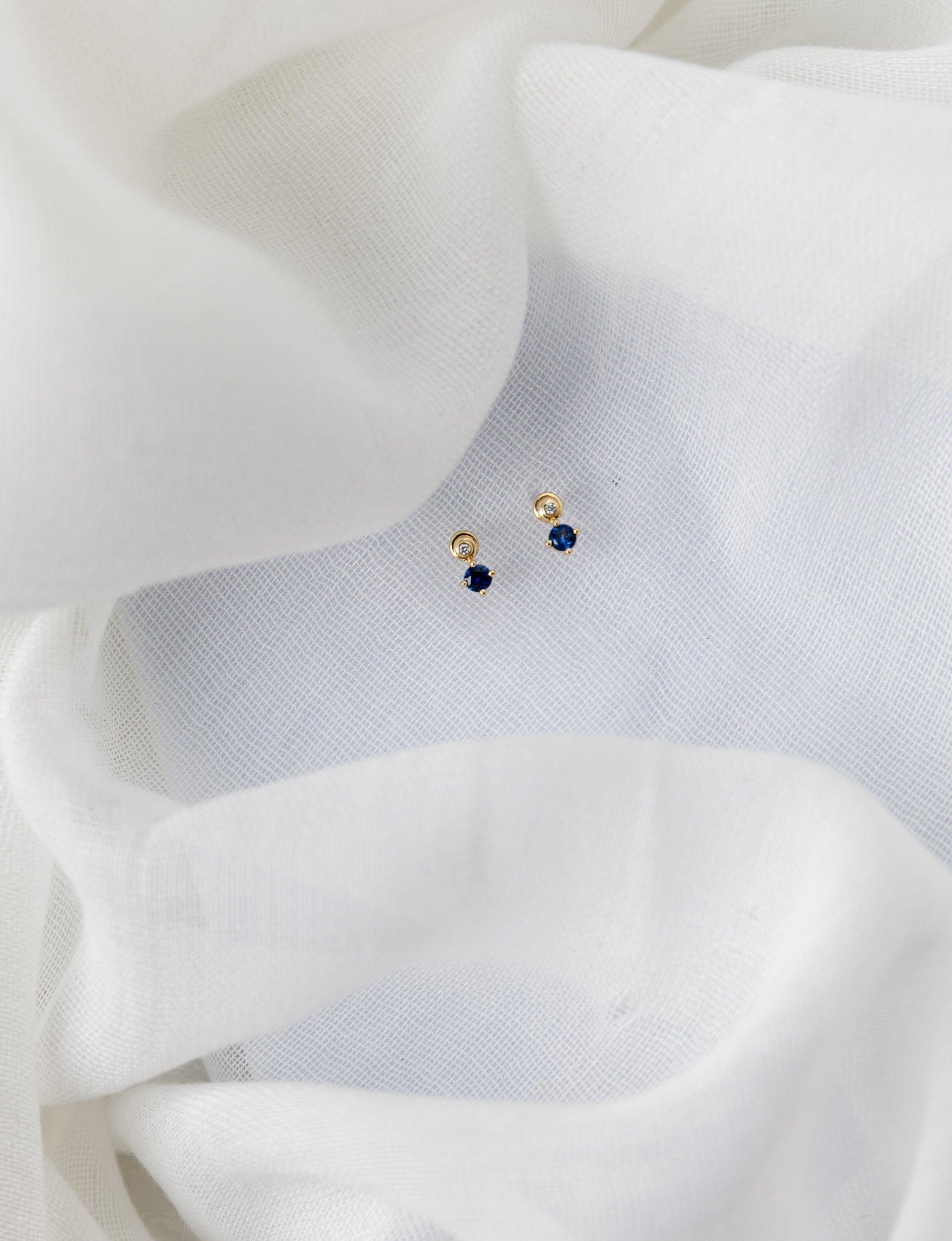 Stella Studs in 14K yellow gold with white diamonds and blue sapphires